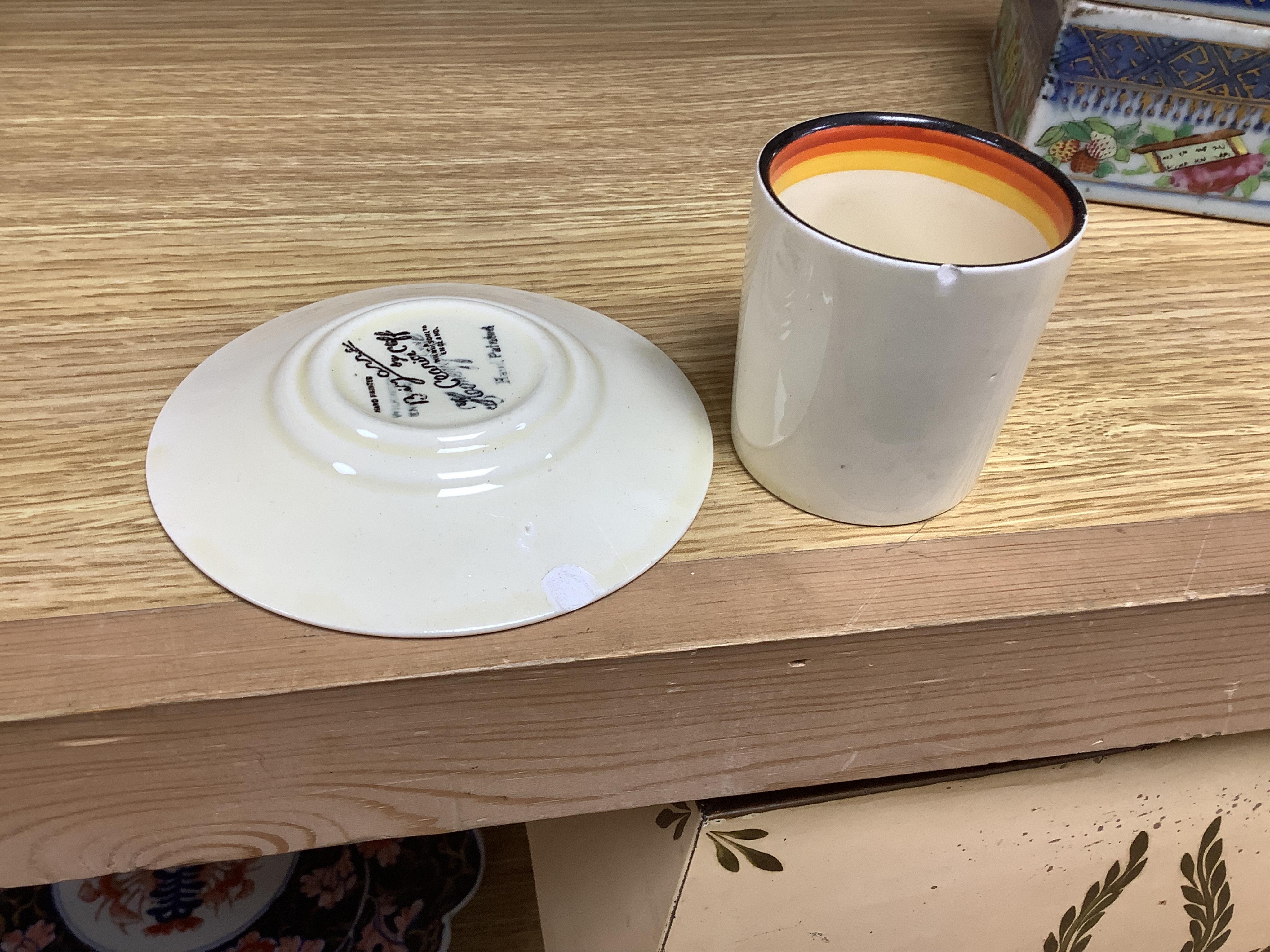 An Art Deco Clarice Cliff Bizarre part coffee set and a similar Rhodanthe-pattern preserve pot and cover, largest 11cm high